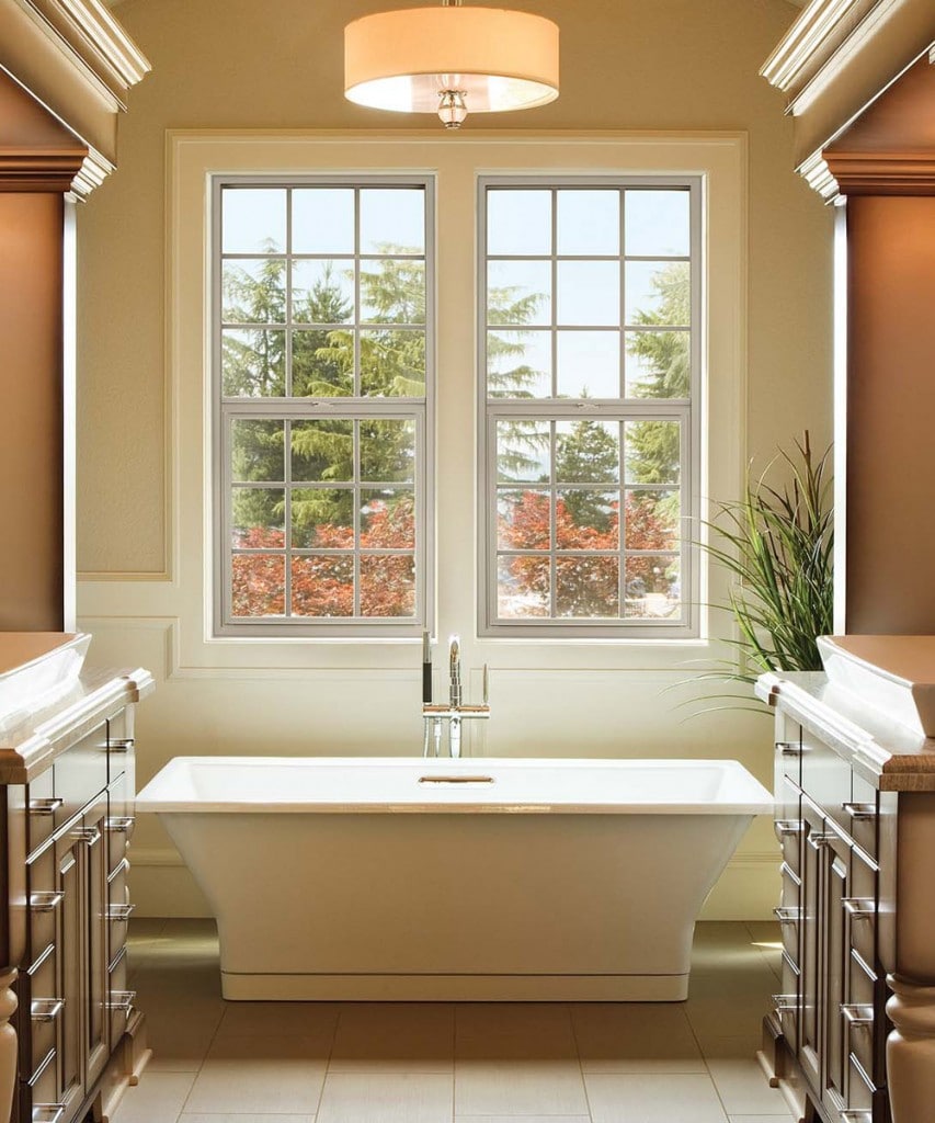 freestanding tub in front of window