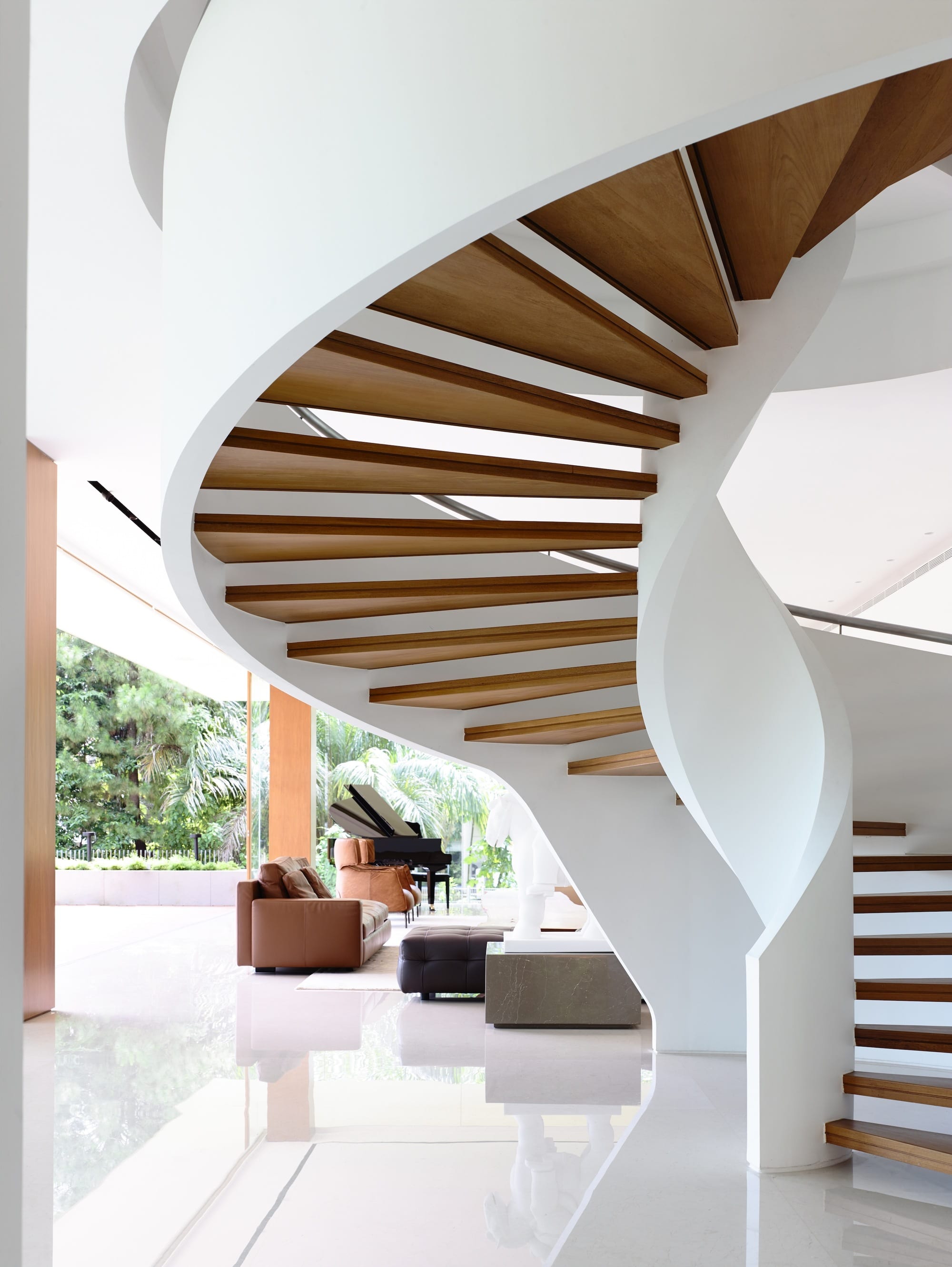 Statement Staircases: Spirals And Sweeps In Luxury Architecture